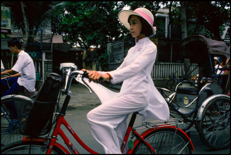 Woman riding her bike, Vietnam