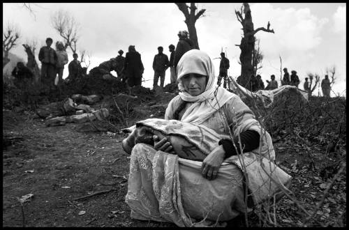 Kurdish woman buries her child in the mountains of Southern Turkey