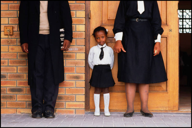 A girl and her parents, Soweto, South Africa