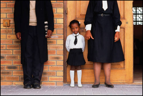 A girl and her parents, Soweto, South Africa