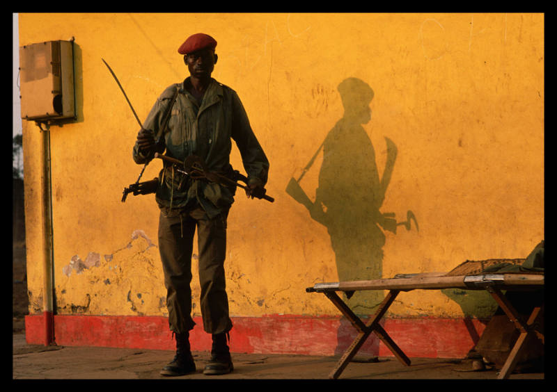 A Zairean soldier looks alert while on patrol in Goma, where thousands of Rwandan refugees had come to escape the civil war in Rwanda, Goma, Democratic Republic of the Congo